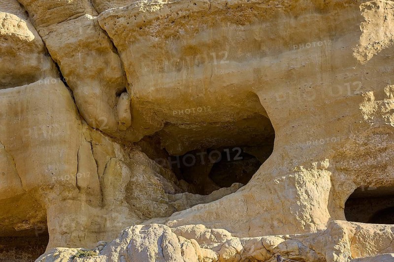 Neolithic caves, former hippie paradise, naturally formed sandstone cliffs with large caves and distinctive structures, Matala, south coast, Crete, Greek Islands, Greece