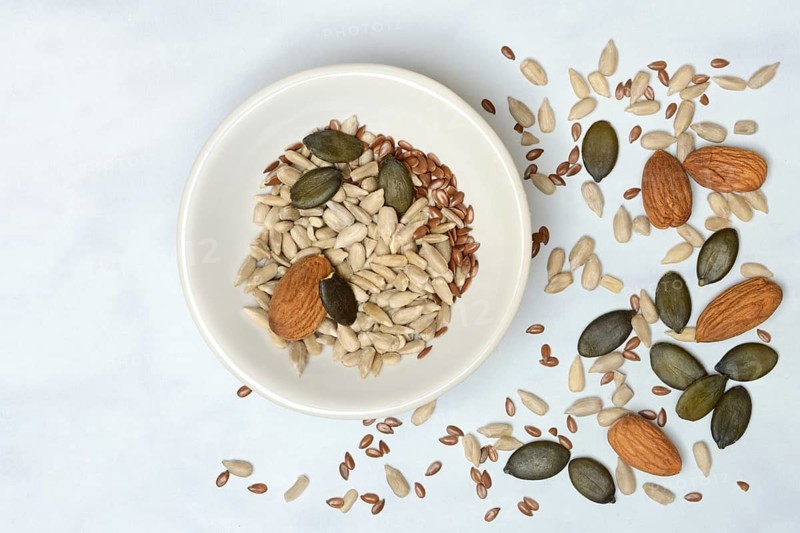 Kernels in shell, kernel mix of almond seeds, sunflower seeds, linseeds and pumpkin seeds