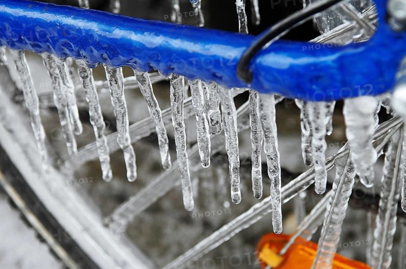 Bicycle icy due to freezing rain, icicles, detailed view