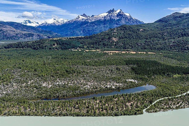River rio delta o el leon, mountain range of Valle Exploradores in the back, aerial view, Patagonia, Chile