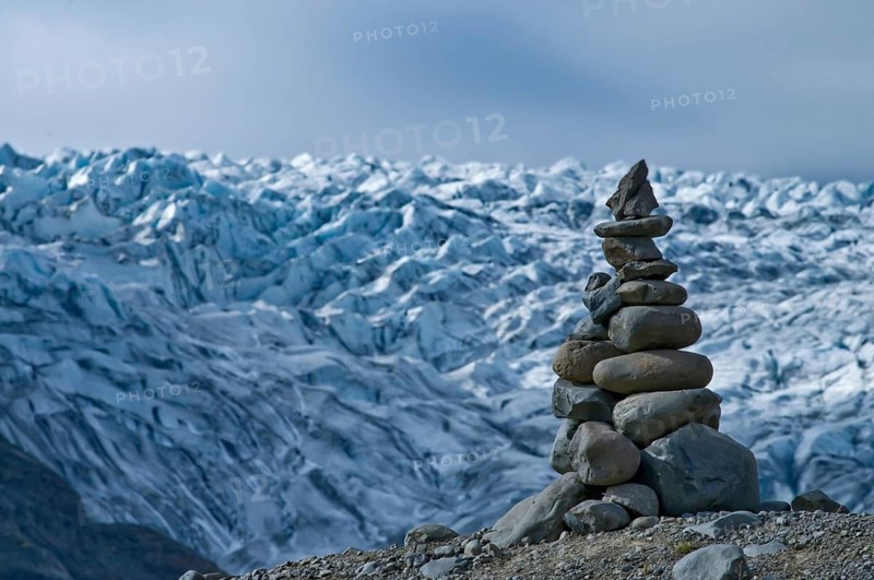 Stone men in front of the Skaftafell glacier in Iceland