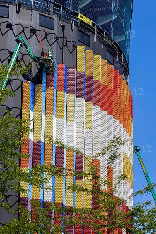 Spectacular timber high-rise building in Constance ahead of completion. The façade of the new Asisi Panorama building consists of three-dimensional metal elements in different colors. In future, the 52-meter high tower will display a huge panoramic painting from the Council of Constance, an important event in the city's history. Konstanz, Baden-Württemberg, Germany