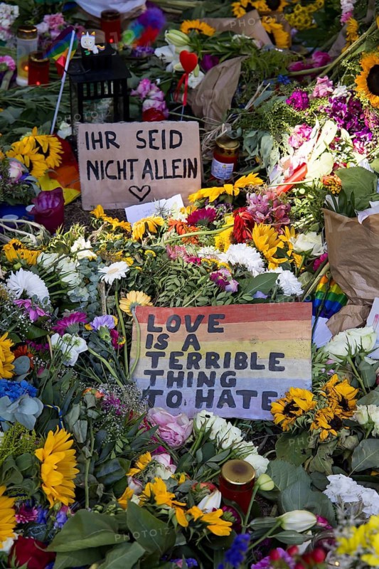 Signs reading ‘You are not alone' and ‘Love is a terrible thing to hate' at an impromptu memorial of flowers and candles at the scene of the incident in Berlin's Tiergarten on 29 July 2026. During the closing rally of Christopher Street Day on 25 July 2026, a driver on a rampage in a van killed at least one participant and seriously injured several others in Berlin's Tiergarten