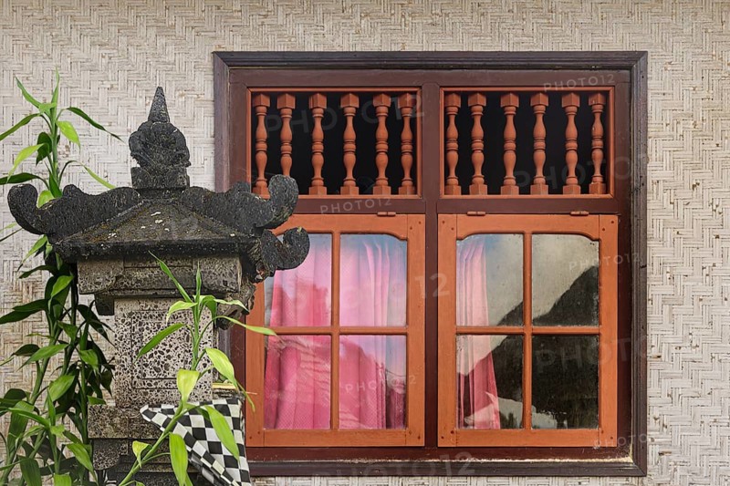Window in traditional Balinese woven bamboo house with altar, Penglipuran Village, Bangli Regency, Bali, Indonesia