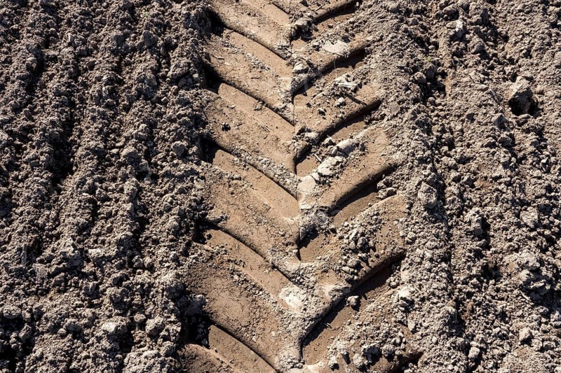 Tractor tracks, agricultural trails at a cultivated field in springtime, farmland near Wesertal, Weser Uplands, Weserbergland, Hesse, Germany