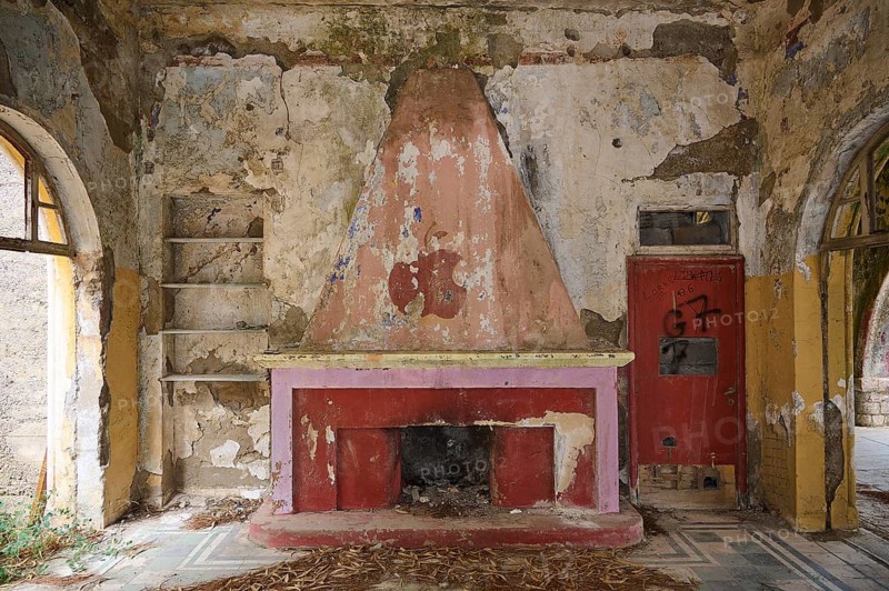 An abandoned fireplace in a dilapidated room surrounded by graffiti and dirty walls, Italian Governor's Palace, Ruins, Italian colonial settlement, Eleousa, Rhodes, Dodecanese, Greek Islands, Greece