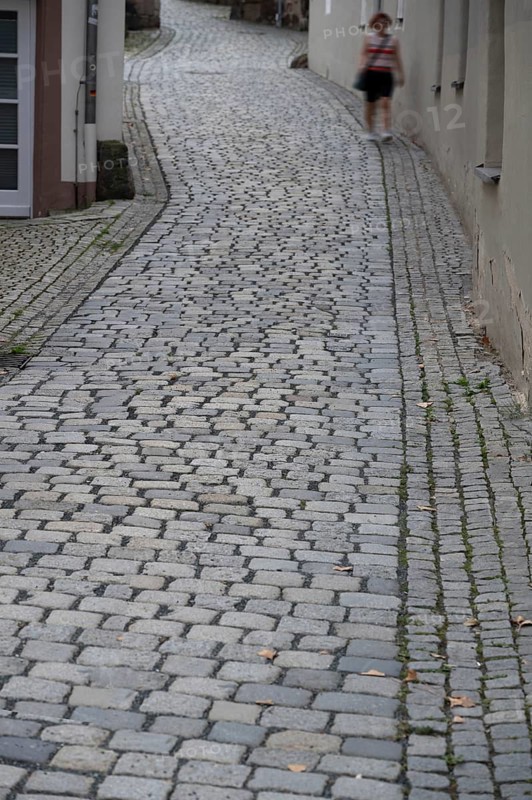 Street paved with basalt stones in the old town centre, Kulmbach, Upper Franconia, Bavaria, Germany