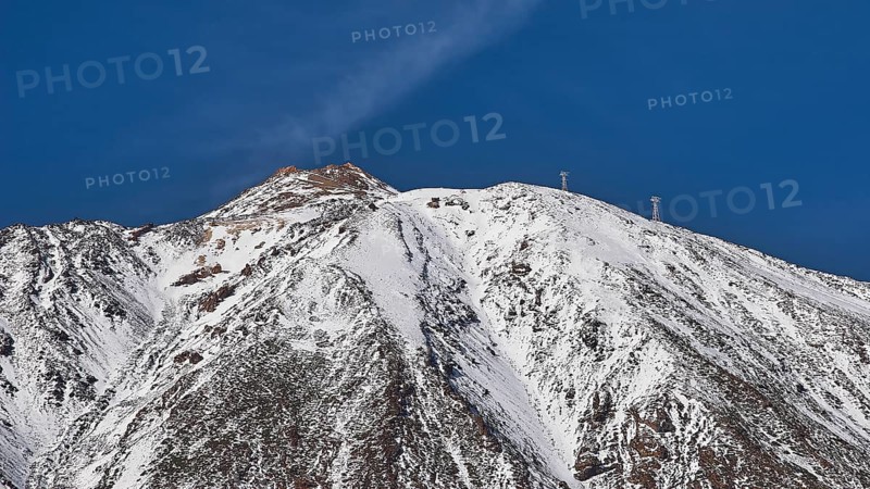 Mount Teide. Mount Teide, A snow-capped mountain peak against a clear blue sky, Teide, Parque Nacional del Teide, Teide National Park, volcano, volcanism, UNESCO World Heritage Site, Tenerife, Canary Islands, Spain