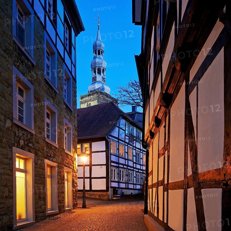 Mariengasse in the old town with half-timbered houses and St Peter's Church in the evening, Soest, North Rhine-Westphalia, Germany