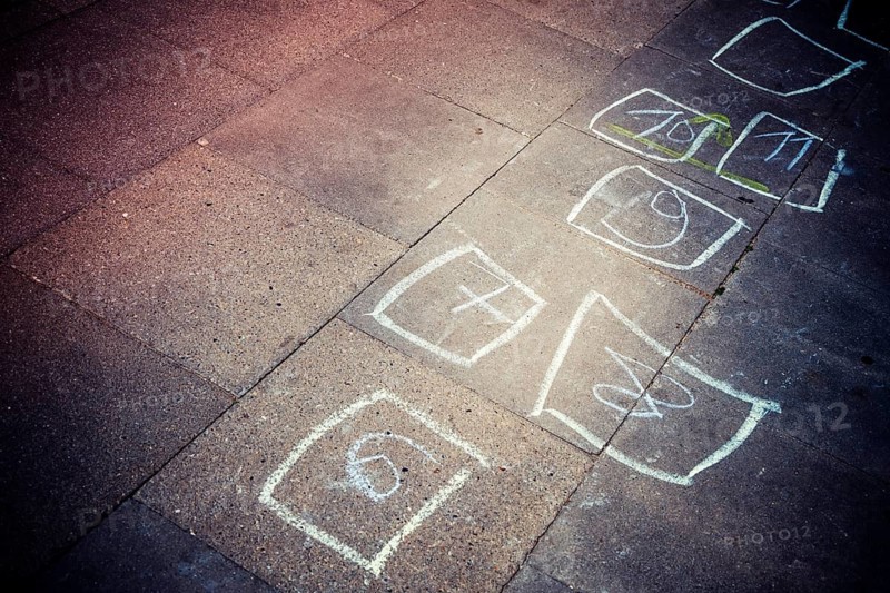 Heaven and hell: boxes with numbers painted by children with chalk on floor plates in Bergedorf, Hamburg, Germany, photo montage +++ editorial use only