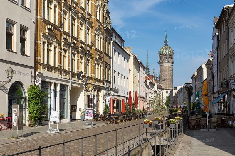 Castle Street with Castle Church Tower and Röhrwasser, Luther city Wittenberg, Saxony-Anhalt, Germany
