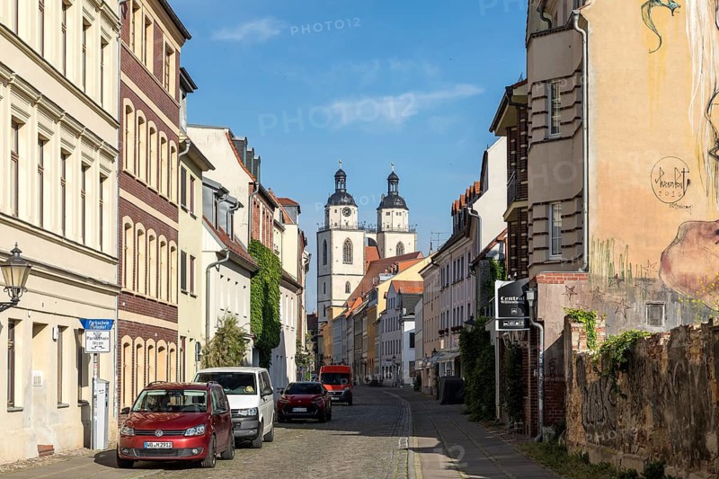 Mittelstraße with towers of the city church, Luther city Wittenberg, Saxony-Anhalt, Germany