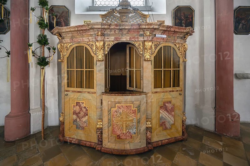 Palm bushes for the Palm Sunday procession next to the Baroque confessional, Holy Trinity parish church, Kösslarn, Marktplatz 35, Lower Bavaria, Germany