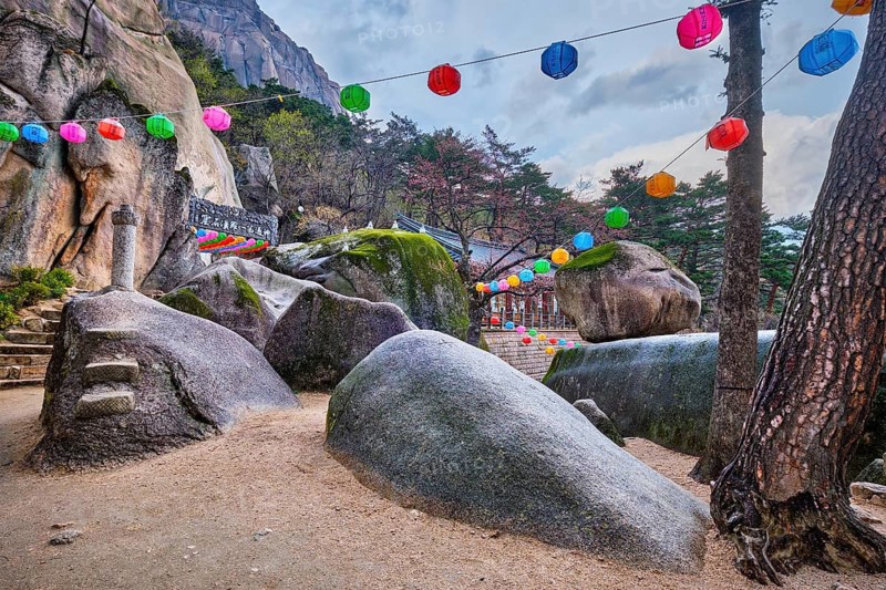 SEORAKSAN, SOUTH KOREA, APRIL 14, 2017: Kyejoam Seokgul Hermitage shrine and Ulsanbawi rock in Seoroksan National park, South Korea
