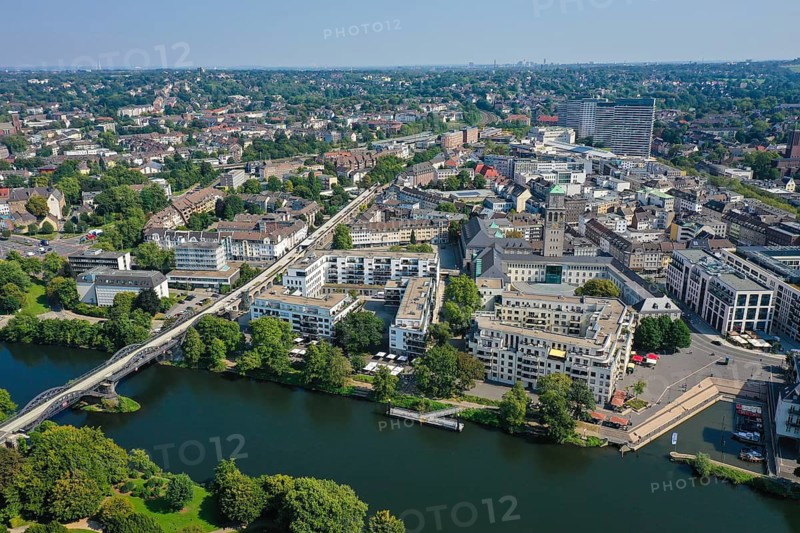 Mülheim an der Ruhr, North Rhine-Westphalia, Germany - City overview Mülheim an der Ruhr, in front the MüGa-Park, behind the city centre with residential buildings, commercial buildings, the new marina and the town hall tower, on the left the new cycle highway, the cycle highway RS1