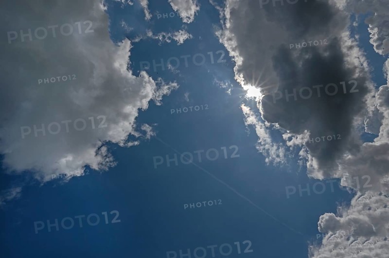 Rain clouds (Nimbostratus) with sunshine, Franconia, Bavaria, Germany