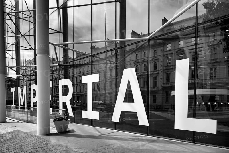 IMPERIAL College, University and Technical College lettering, Victorian houses reflected in the glass façade, London, black and white, South Kensington, London, England, Great Britain, Great Britain