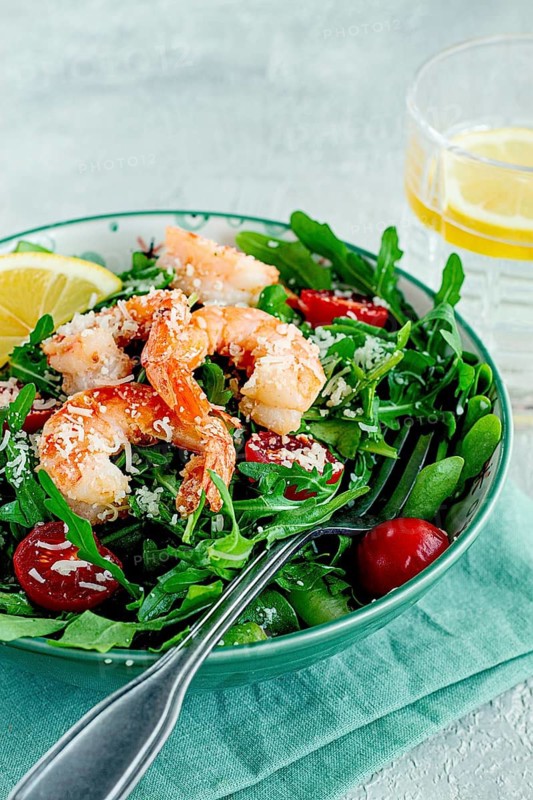 Shrimp salad with arugula and cherry tomatoes, with parmesan cheese, healthy food