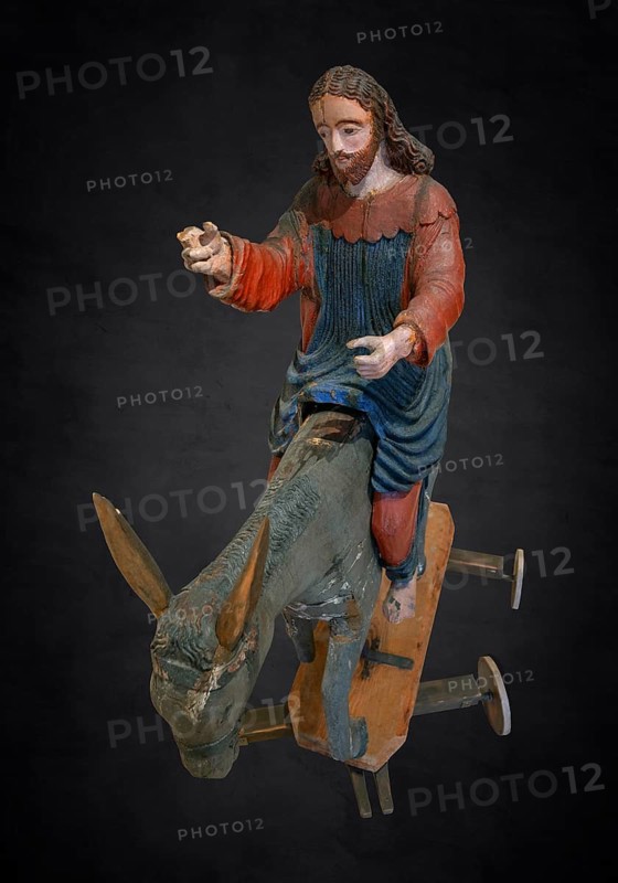 Christ on the palm donkey, on a dark background, wooden figure from around 1400, Museum Bezau, Vorarlberg, Austria
