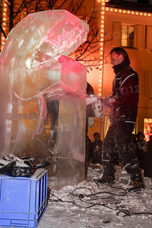 An ice sculpture is being created: ice carving street action as part of the long shopping night in the city center of Reutlingen, Baden-Württemberg, Germany, for editorial use only