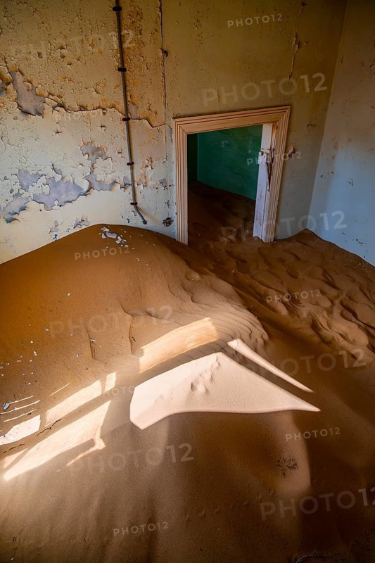 Interior view, doors and house full of sand, former diamond mining town, Namib Desert, Kolmanskop, Karas, Namibia