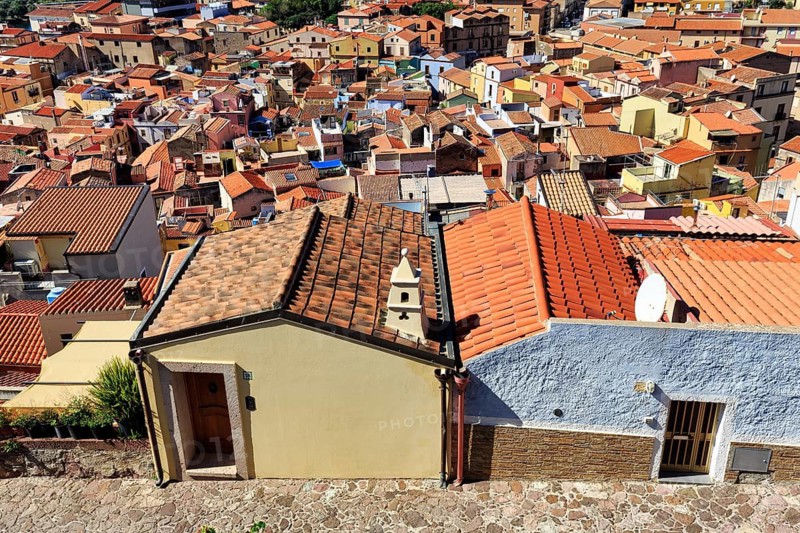View of the historic old town of Sa Costa, colorful sea of houses, roof landscape, terracotta roofs, Bosa, Oristano, Sardinia, Italy