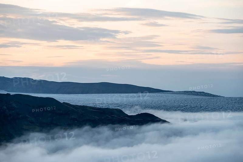 Fog over the glacier ice of Myrdalsjökull glacier, at sunset, Pakgil, Iceland