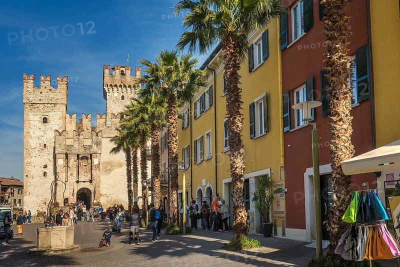 Medieval castle and colorful houses, Castello Scaligero, Scaliger Castle, Sirmione, Lake Garda, Brescia Province, Lombardy Region, Italy