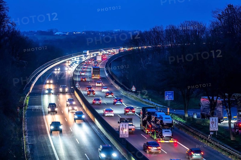 Evening traffic on the A52 motorway, between Düsseldorf and Essen, at the Ruhr Valley Bridge, across the Ruhr near Mülheim-Mintard, partly slow, rush hour traffic, looking north, North Rhine-Westphalia, Germany