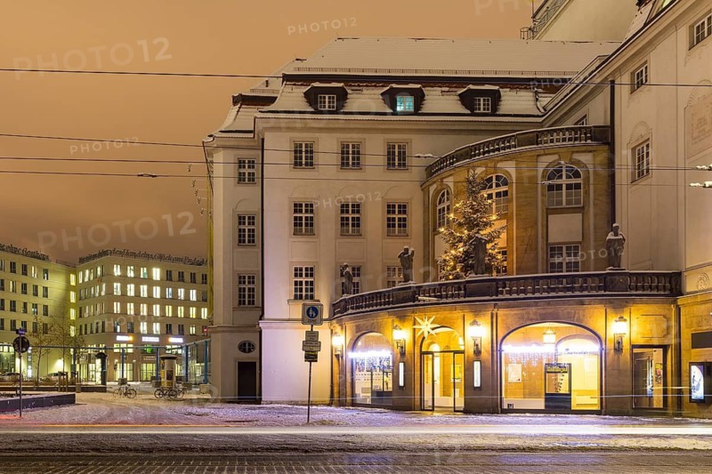 Box office foyer and Christmas tree of the theatre with snow, night shot, Dresden, Saxony, Germany