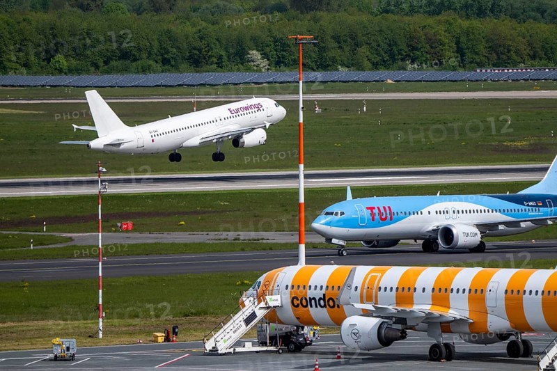Eurowings aircraft takes off on Hauptbahn Süd, TUI Boeing 737 on taxiway, Condor flieger on apron, Düsseldorf Airport, DUS, North Rhine-Westphalia, Germany