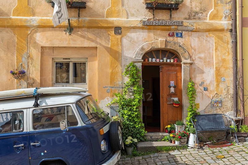 One van Volkswagen Bulli T2 standing in front of the Lazy River Hostel in Loket, Czech Republic