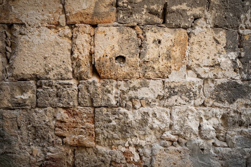Close-up of a very old stone wall with weathered texture, Palermo, Sicily, Italy