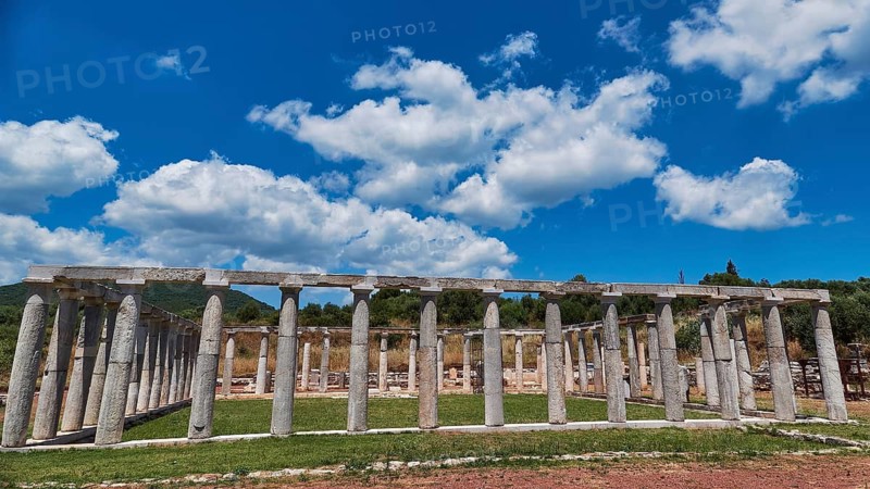 Ancient structure of columns in a meadow under a cloudy sky, ancient site, archaeological site, Messene, Messini, Messinia, southwest of the Peloponnese, odyssey, Odyssey, Odysseus, Ulysses, film, filming location, Matt Damon, Peloponnese, peninsula, Greece