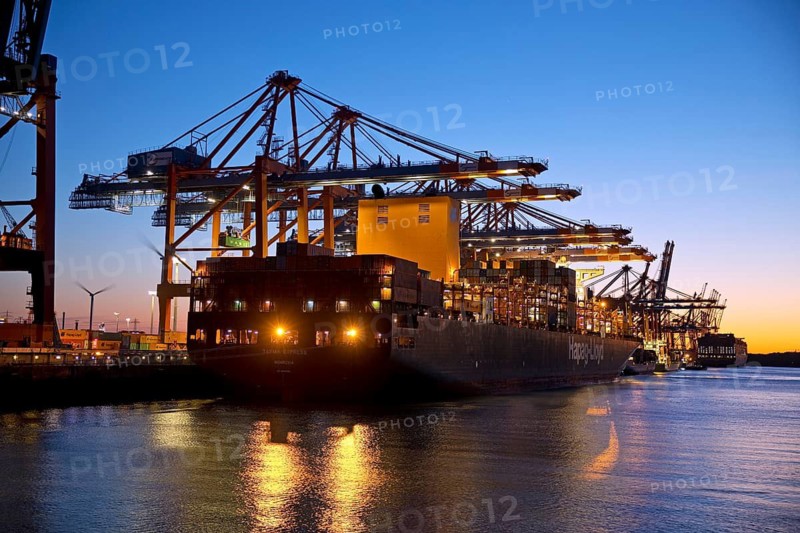 Container ships at the Eurogate container terminal in the evening with an atmospheric sunset, harbour, Hamburg, Germany