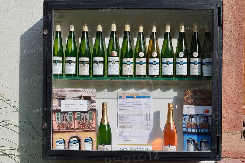 Showcase with wine bottles, Eguisheim, Haut-Rhin, Alsace, Grand Est, France