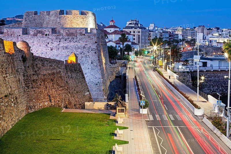 The Royal walls and bastions with a night view of the city of Ceuta, Spain, North Africa