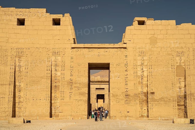 Pylon with reliefs of the mortuary temple of Ramesses III in Medinet Habu, West Thebes near Luxor, Egypt