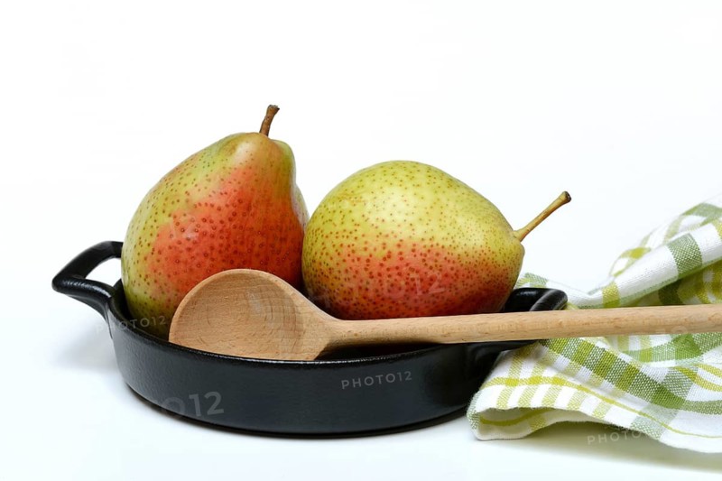 Pears in pot with cooking spoon, symbolic picture