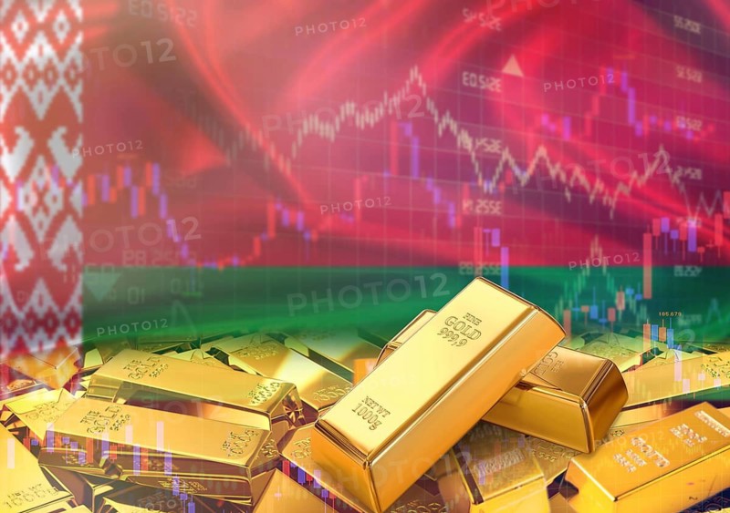 Gold bars on Belarusian flag in background. Gold bars stacked on Belarusian flag. Concept of Belarus gold reserves