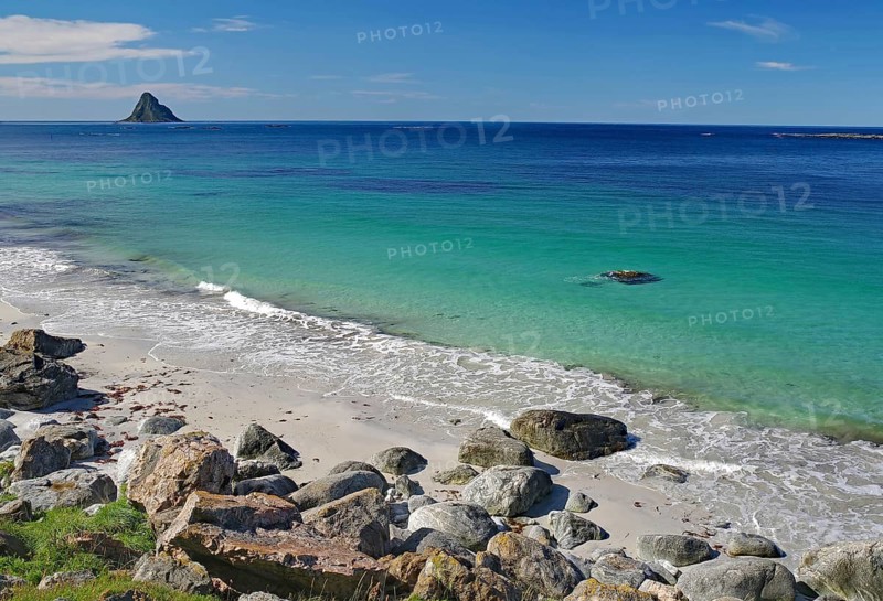 A clear day on a rocky beach with turquoise sea water, Andoeya, Bleik, Bleiksøya, Vesteralen, Norway