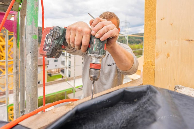 A worker uses a drill on a construction site, residential renovation, Nagold, Calw district, Germany