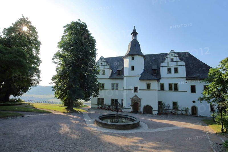 Renaissance castle in backlight with ornamental fountain, Dornburg Palaces, Dornburg-Camburg, Thuringia, Germany