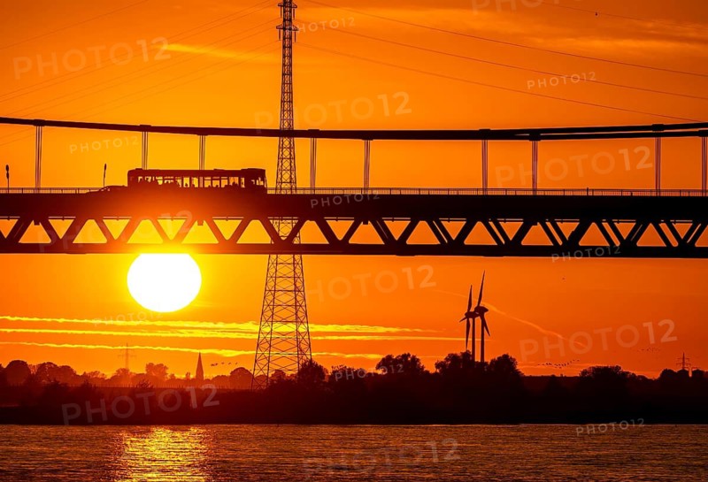 Traffic on the Rhine bridge Emmerich, federal road B220, evening light, with 803 m the longest suspension bridge in Germany shortly in front of the Dutch border, Rhine kilometre 853, 2 it is the northernmost German Rhine bridge, North Rhine-Westphalia, Germany