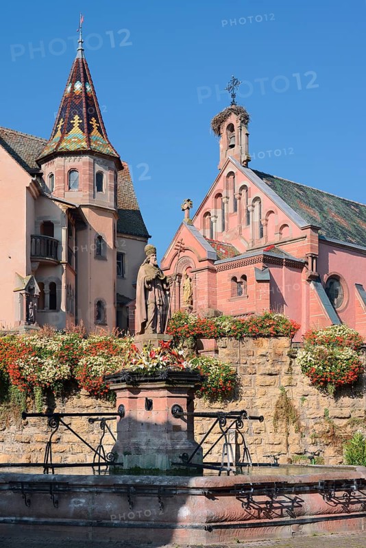 Castle with St. Leo IX chapel and fountain with statue of Pope Leo IX, Eguisheim, Haut-Rhin, Alsace, Grand Est, France