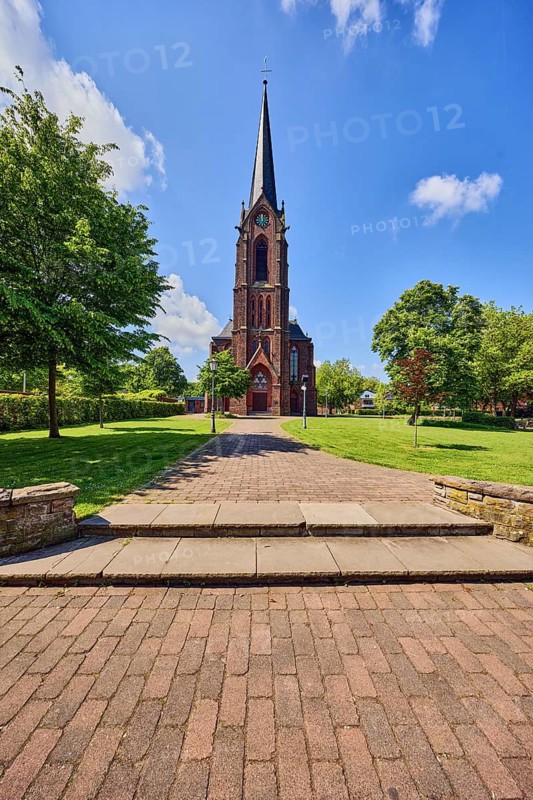 St. Nicholas parish church, church tower, sandstone wall, staircase, green area Bürgerpark, lawn, path, trees, blue sky, cumulus clouds, Aldekerker Straße, Rathausstraße, Rheurdt, Kleve district, North Rhine-Westphalia, Germany