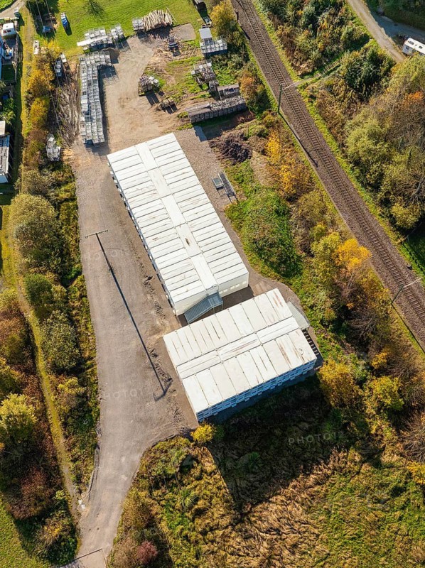 Aerial view of an industrial complex with railway tracks and vegetation, refugee accommodation Beermiß, Calmbach, Black Forest, Germany