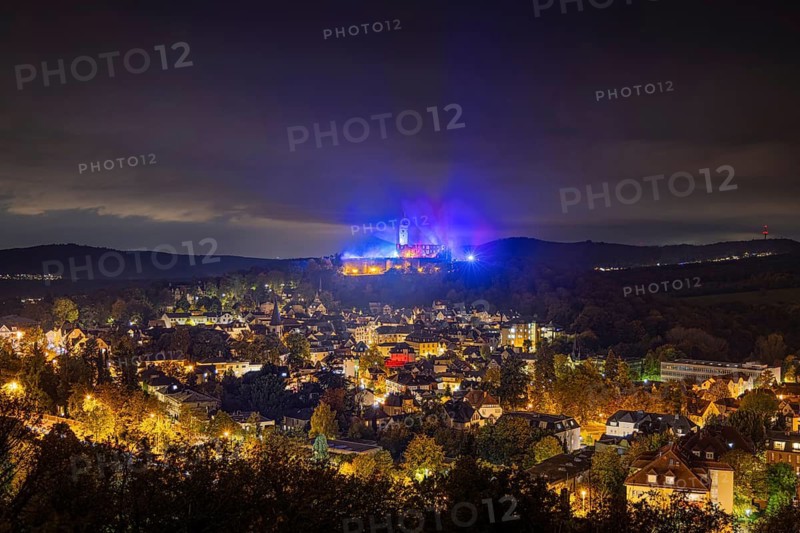The castle in the town of Königstein im Taunus is brightly illuminated in the evening. From 18 October to 3 November 2024, the castle ruins will host the Frankenstein Halloween Festival under the motto A new Chapter of Fear, Taunus, Königstein, Hesse, Germany