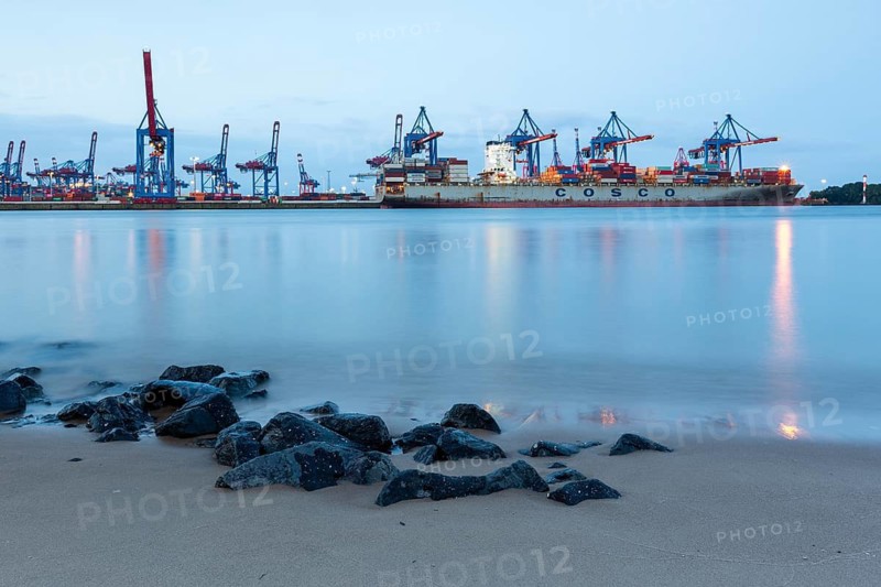Elbe beach with container terminal and ships in the background in Hamburg