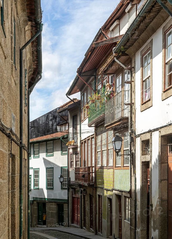 Street of historic buildings with balconies, Rua das Trinas, city centre Guimaraes, northern Portugal